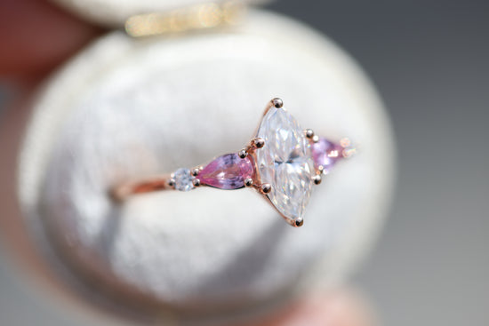 Five stone lattice setting with marquise moissanite and pink sapphire