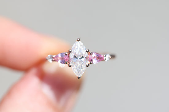 Five stone lattice setting with marquise moissanite and pink sapphire