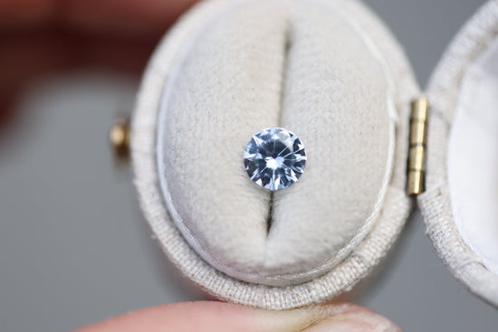 Load image into Gallery viewer, .86ct round light blue silver sapphire
