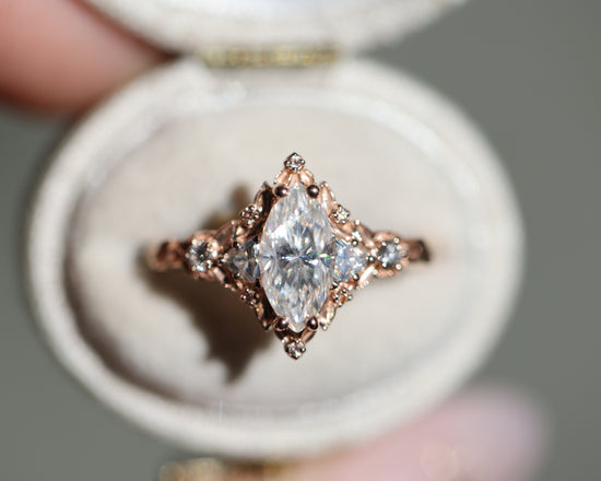 Briar rose five stone with 10x5mm marquise moissanite and peach sapphire