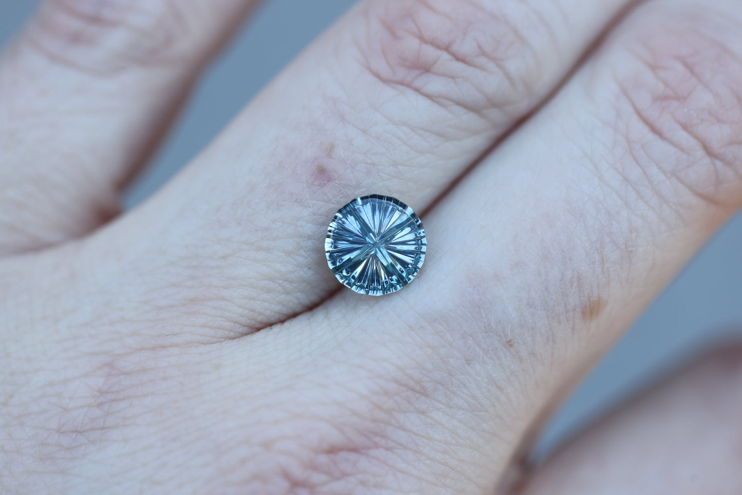 1.67ct round blue teal sapphire, Starbrite cut by John Dyer