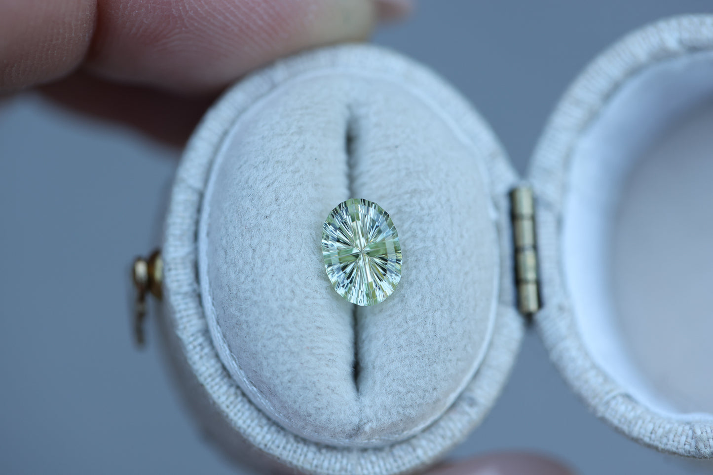 1.23ct oval light yellow green sapphire, Starbrite cut by John Dyer