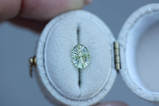 1.23ct oval light yellow green sapphire, Starbrite cut by John Dyer