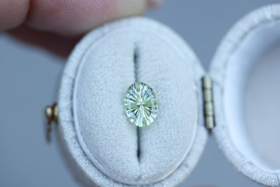 1.23ct oval light yellow green sapphire, Starbrite cut by John Dyer