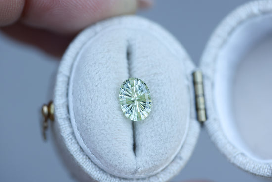 1.23ct oval light yellow green sapphire, Starbrite cut by John Dyer