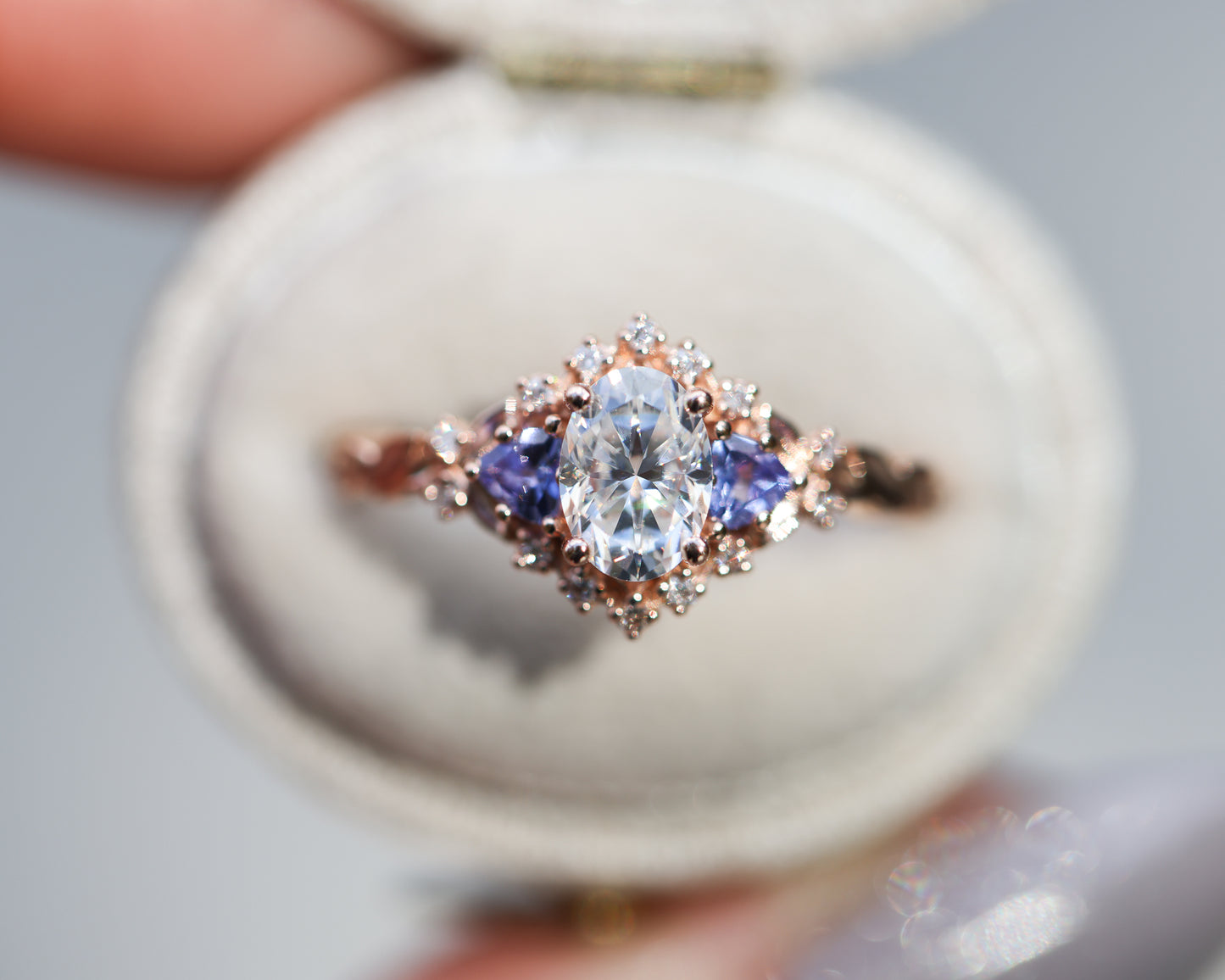 Briar rose three stone half halo with moissanite and tanzanite