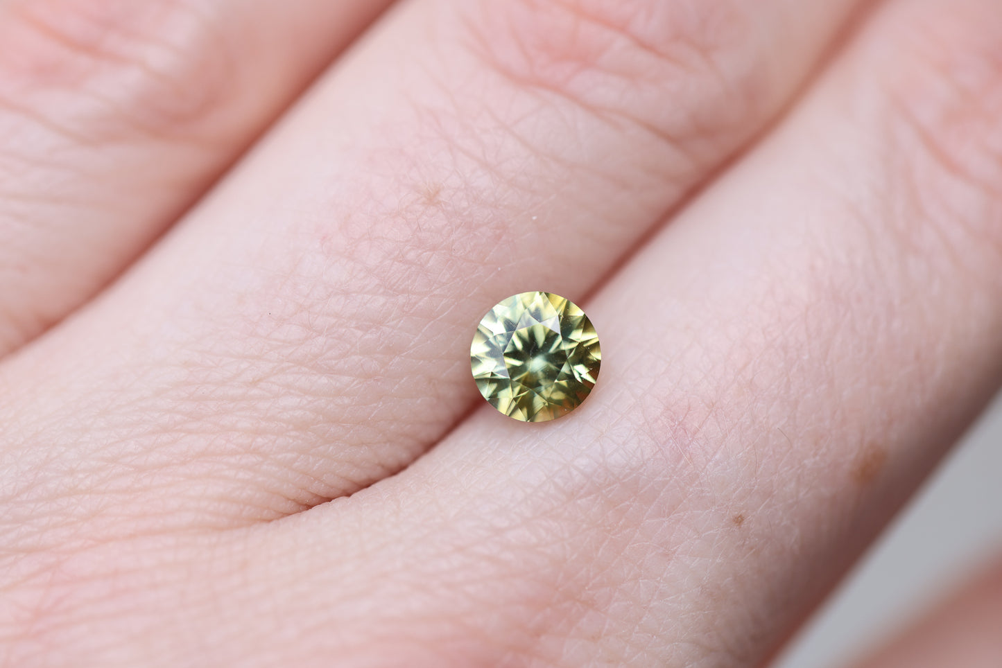 1.55ct round yellow green sapphire