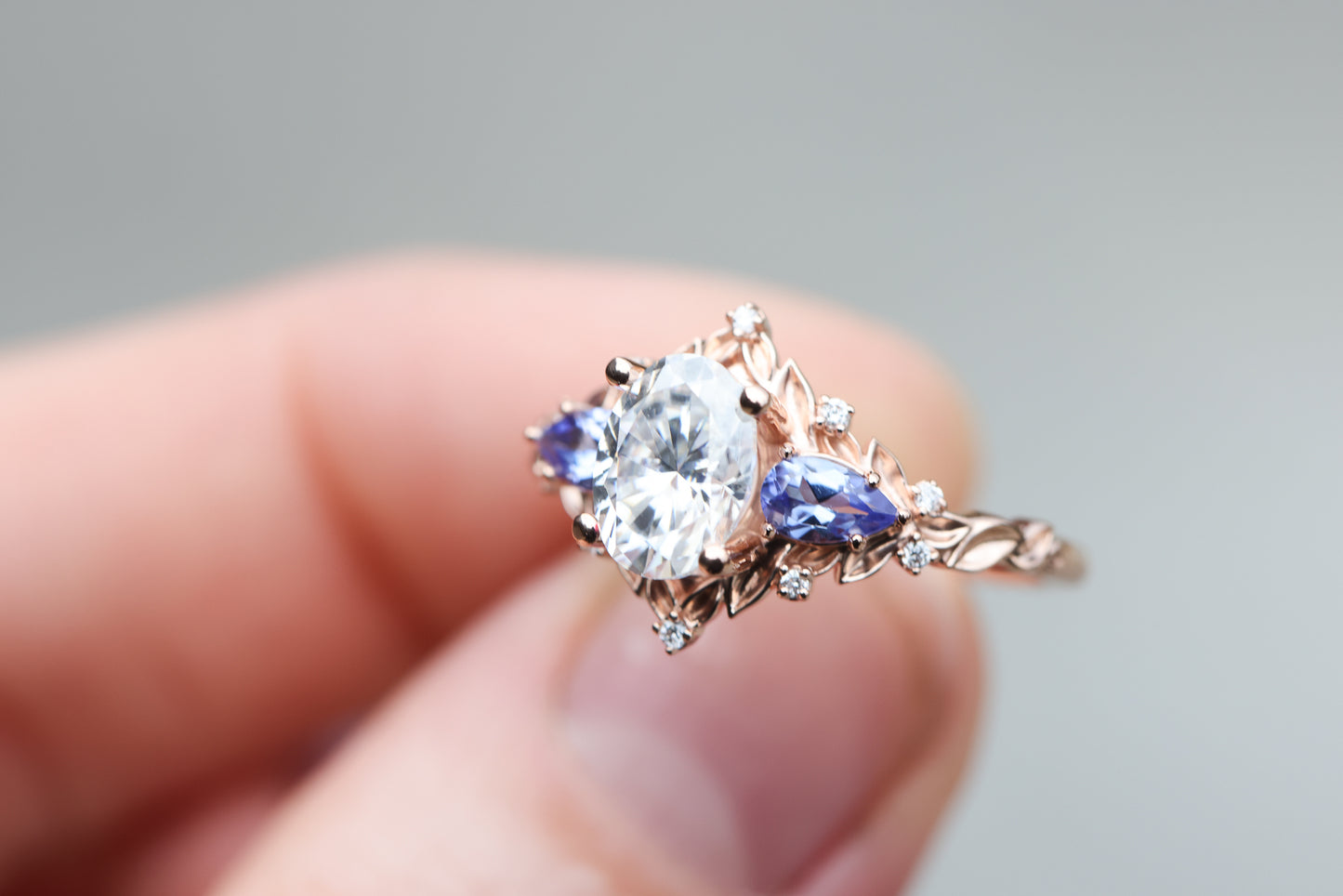 Briar rose three stone with 8x6mm oval moissanite and pear tanzanite