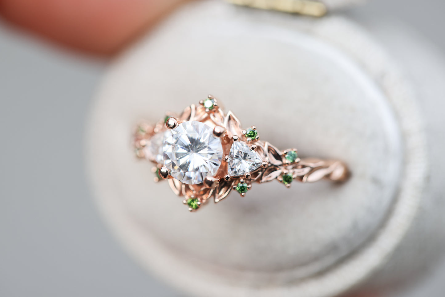 Load image into Gallery viewer, Briar rose three stone with 5.5mm round moissanite and green diamonds accents
