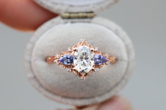 Load image into Gallery viewer, Briar rose three stone with 8x6mm oval moissanite and pear tanzanite
