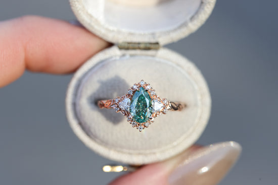 Briar half halo with 8x5mm pear teal moissanite