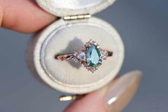 Briar half halo with 8x5mm pear teal moissanite