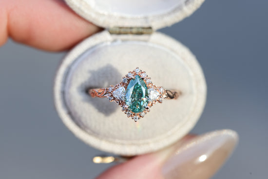 Briar half halo with 8x5mm pear teal moissanite