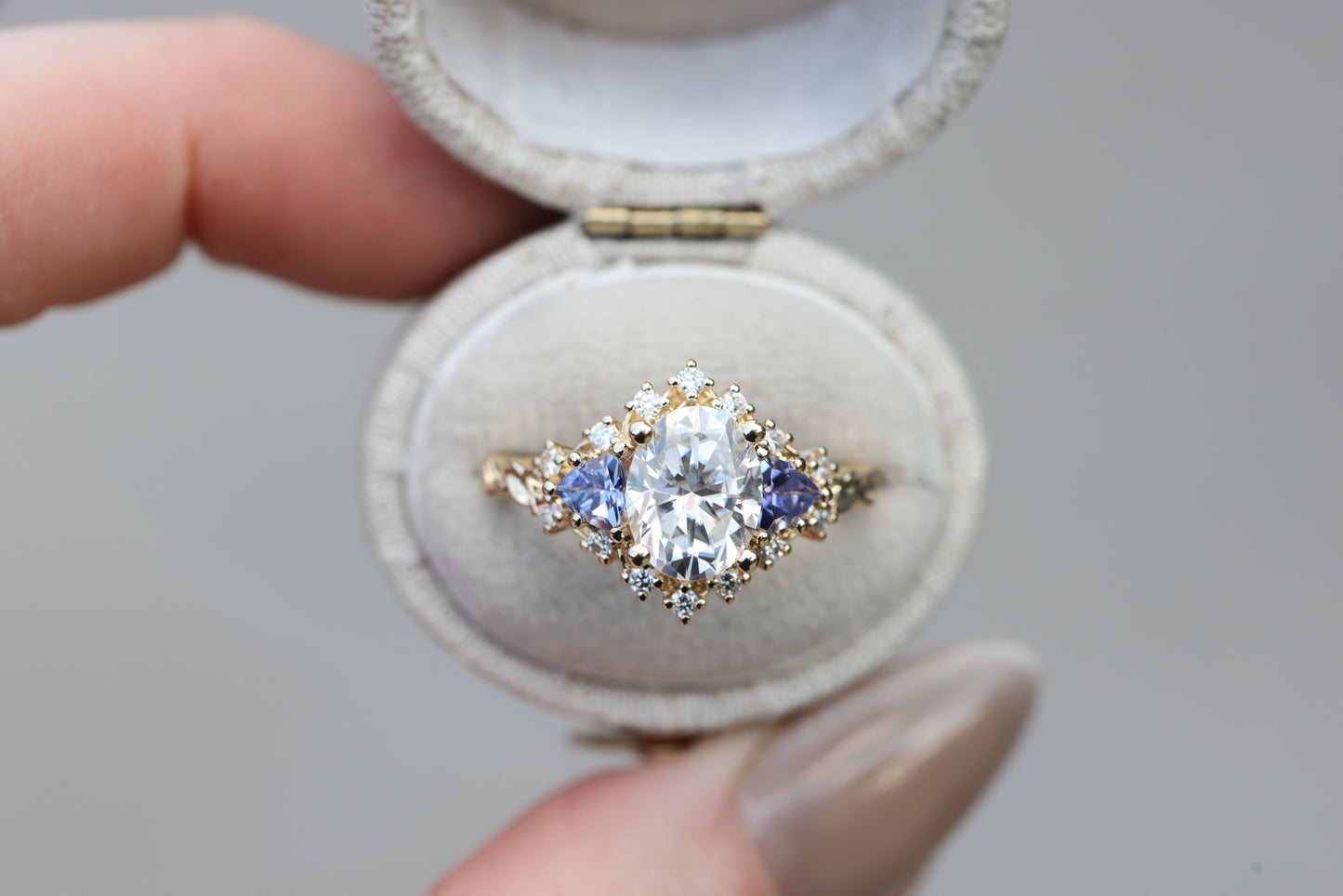 Briar half halo with 9x7mm moissanite and tanzanite