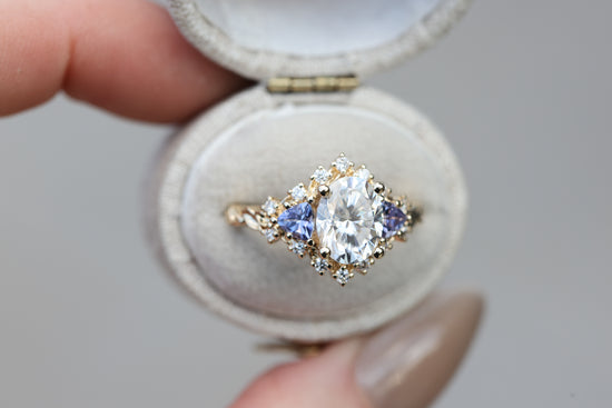 Briar half halo with 9x7mm moissanite and tanzanite