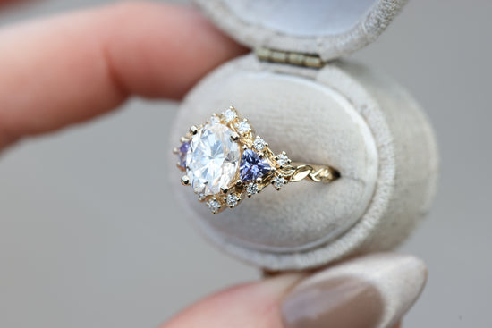 Briar half halo with 9x7mm moissanite and tanzanite