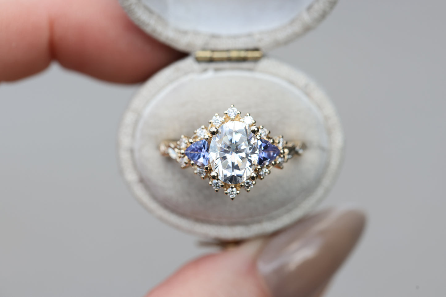 Briar half halo with 9x7mm moissanite and tanzanite