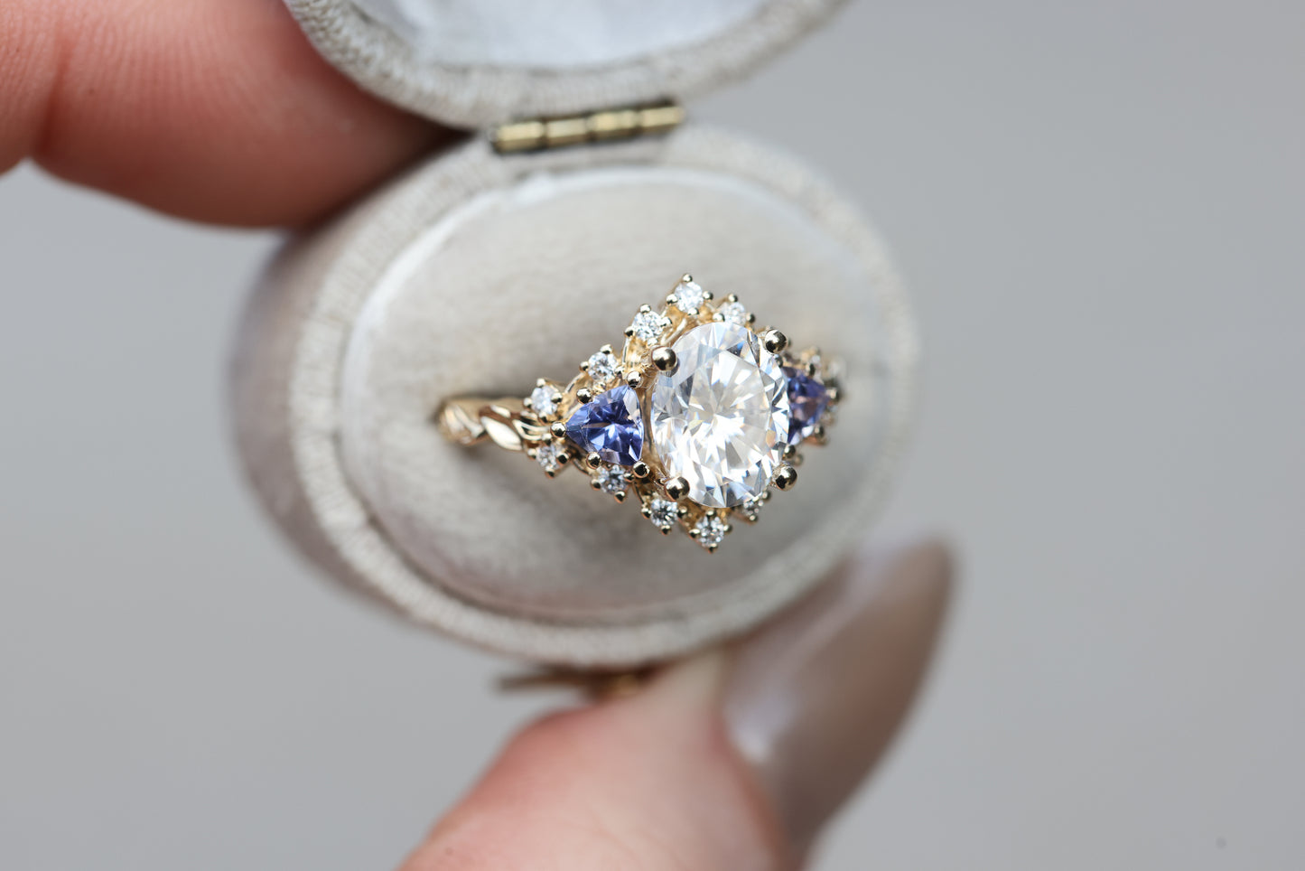 Briar half halo with 9x7mm moissanite and tanzanite