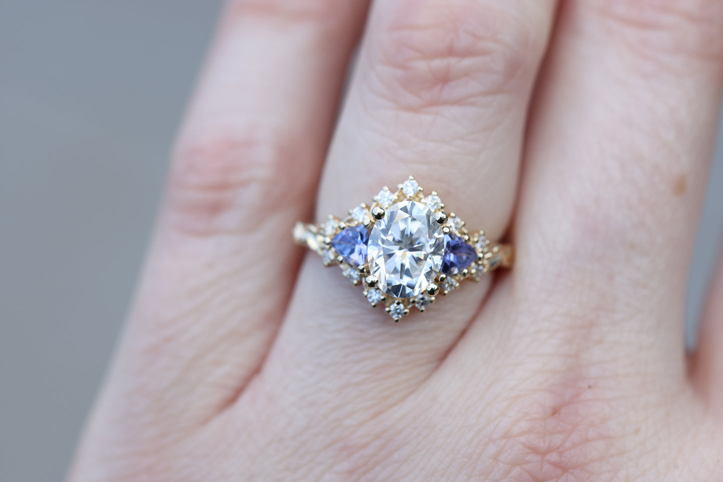 Briar half halo with 9x7mm moissanite and tanzanite