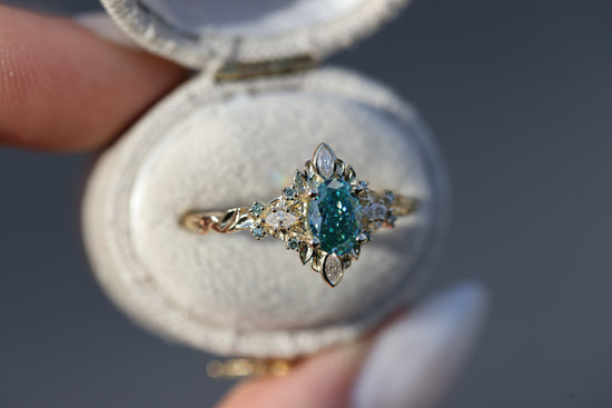 Galadriel with 7x5mm oval teal moissanite