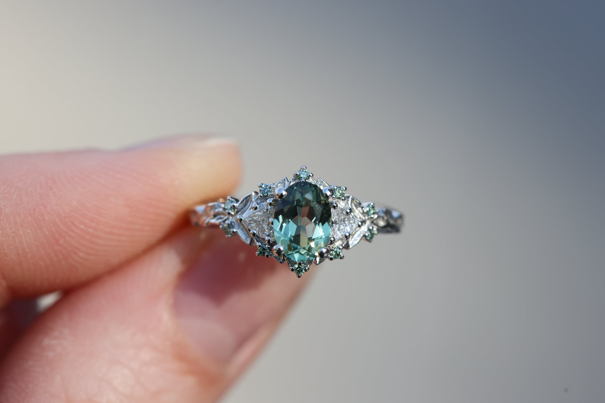 Briar Rose Three Stone with 7x5mm oval light green sapphire and