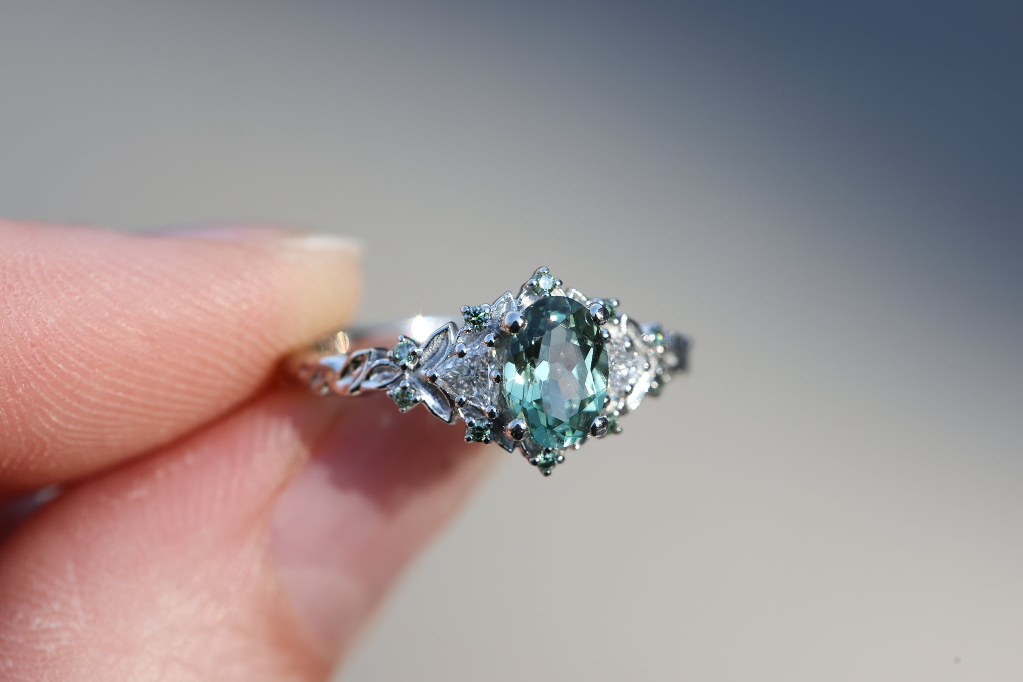Briar Rose Three Stone with 7x5mm oval light green sapphire and