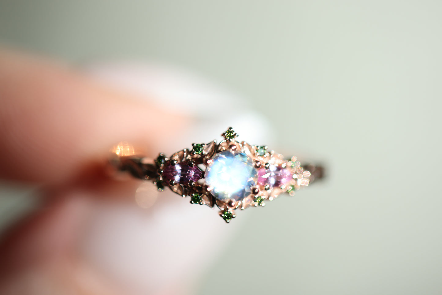 Load image into Gallery viewer, Briar rose three stone with 5mm round moonstone and pink sapphire/green diamond accents
