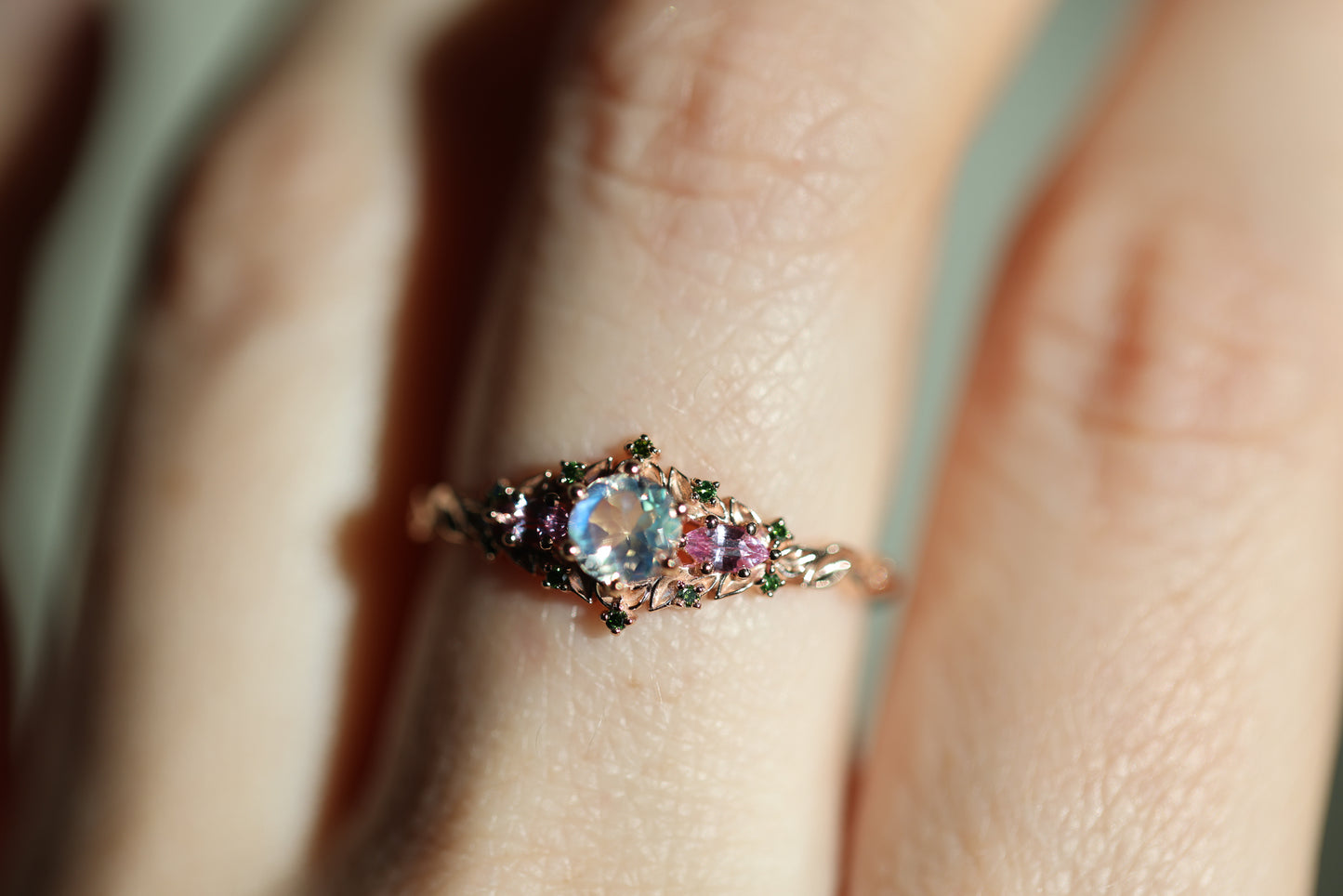 Load image into Gallery viewer, Briar rose three stone with 5mm round moonstone and pink sapphire/green diamond accents
