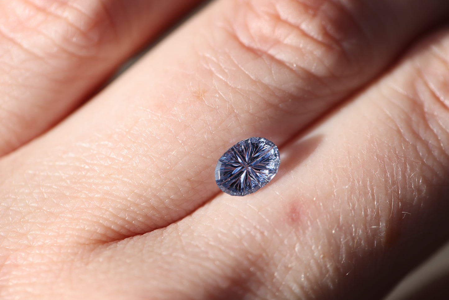 1.05ct oval purple blue- Starbrite cut by John Dyer