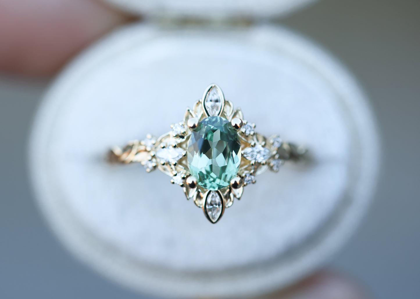 Load image into Gallery viewer, Galadriel setting with oval 7x5mm lab green sapphire
