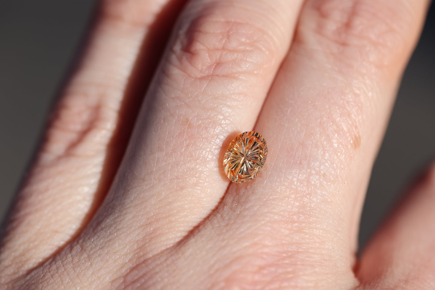 1.86ct oval orange Parti sapphire, Starbrite cut by John Dyer