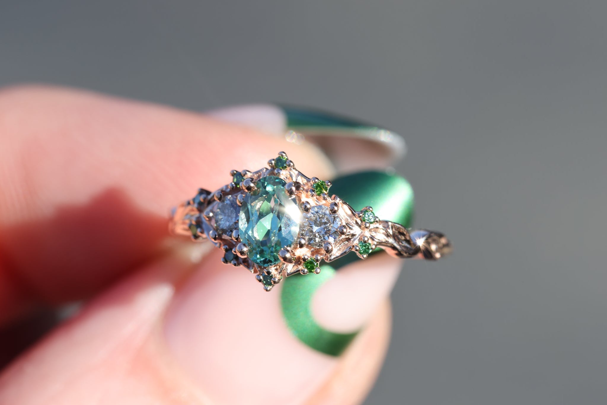 Briar rose three stone with oval lab green sapphire and salt and