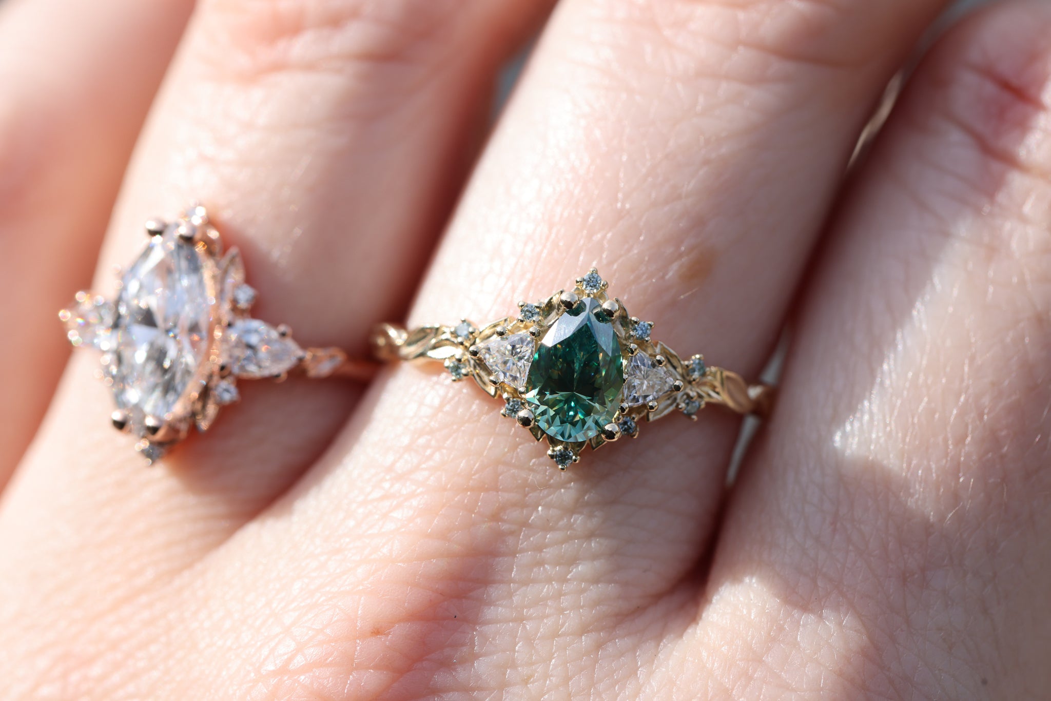 Briar Rose Three Stone with 8x5mm pear teal moissanite center and