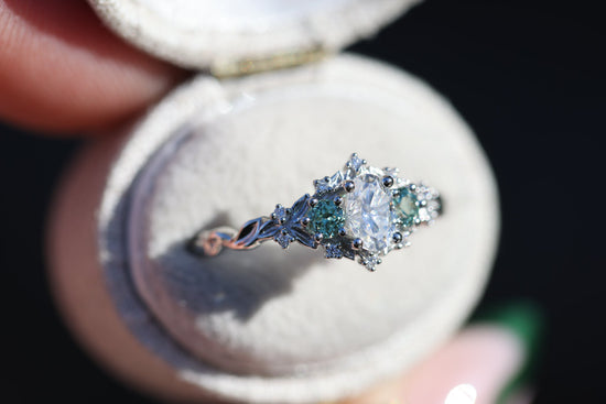 Briar rose three stone with moissanite and round lab green sapphire sides