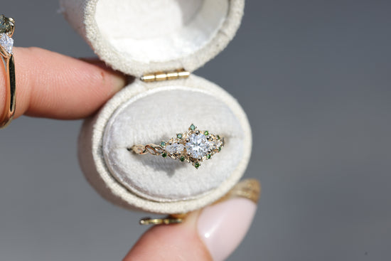 Briar rose three stone with round moissanite and dark green diamonds