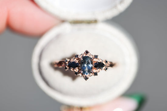 Briar rose three stone with oval grey spinel and black diamonds