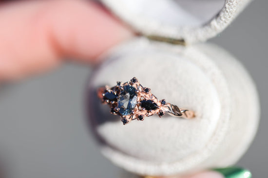 Briar rose three stone with oval grey spinel and black diamonds