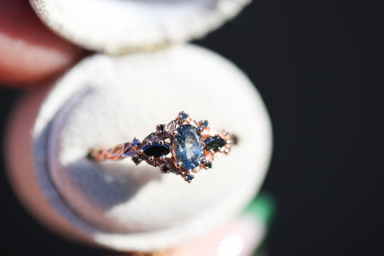 Briar rose three stone with oval grey spinel and black diamonds