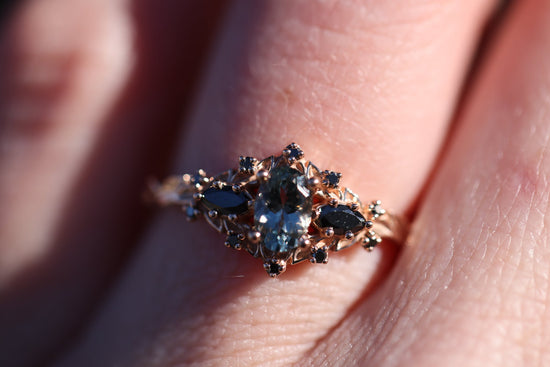 Briar rose three stone with oval grey spinel and black diamonds