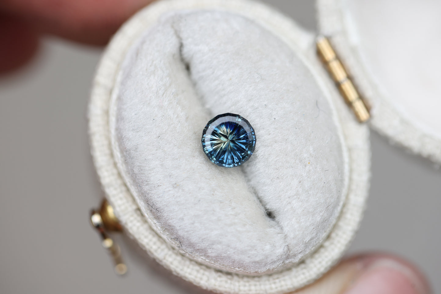 .69ct round parti sapphire, Starbrite cut by John Dyer