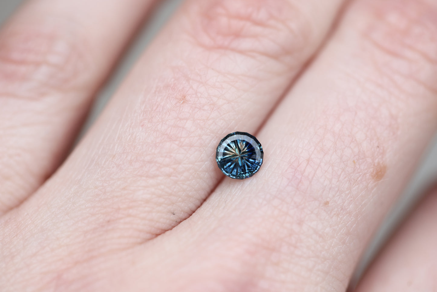 .69ct round parti sapphire, Starbrite cut by John Dyer