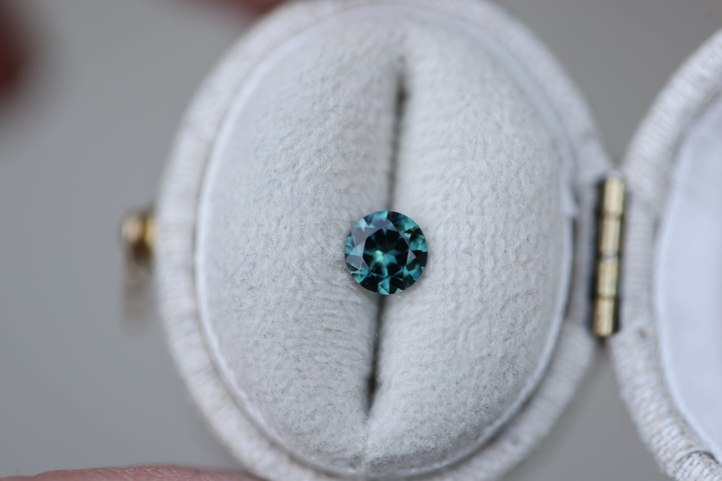 .55ct round teal green sapphire