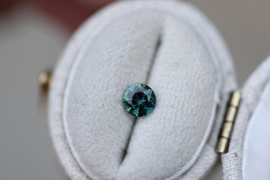 .62ct round teal green sapphire