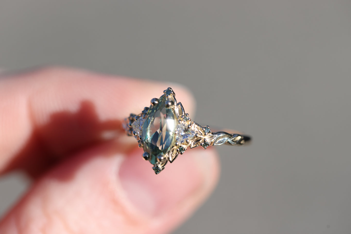 Briar Rose Three Stone with 10x5mm marquise lab green sapphire, mint diamond accents