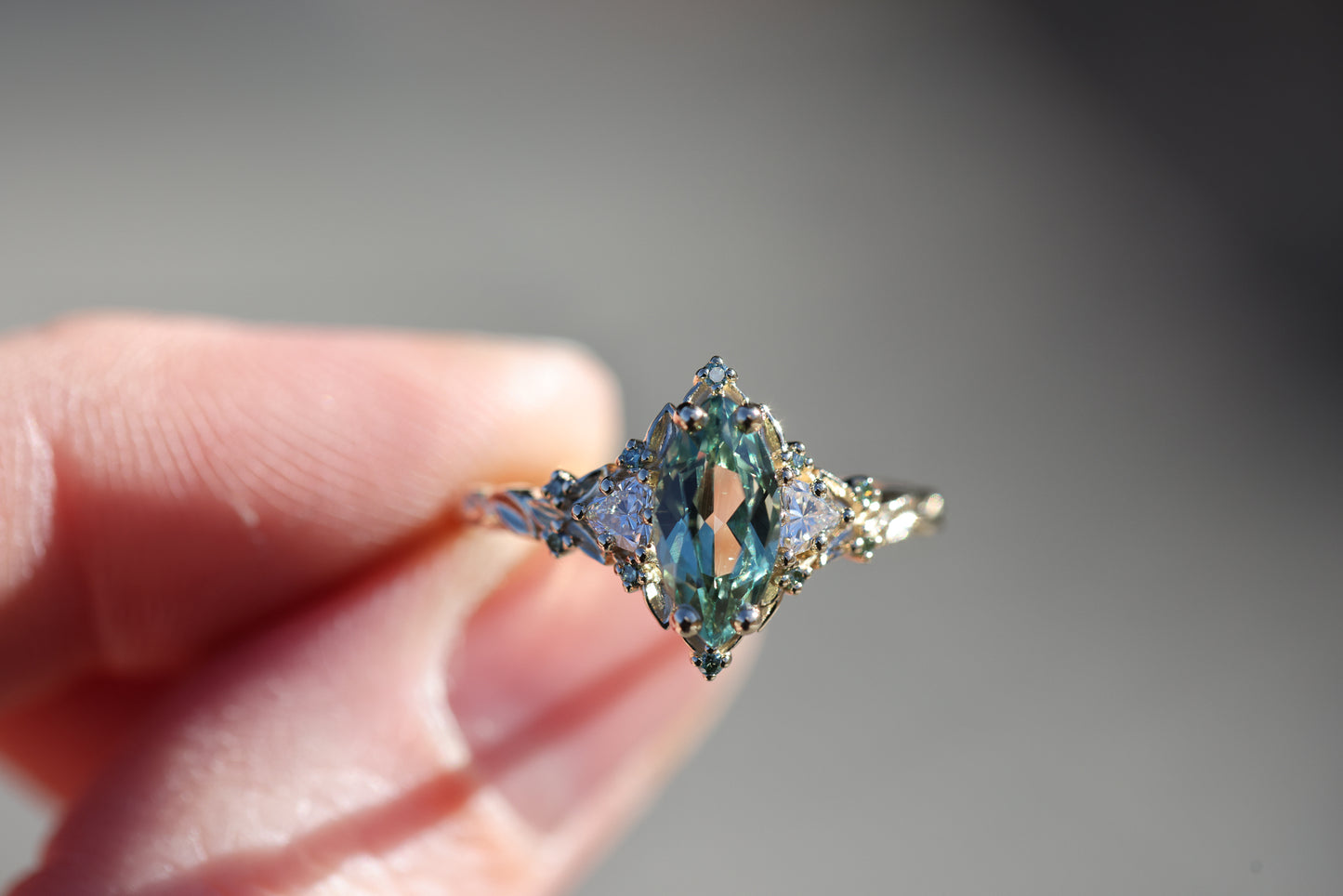 Briar Rose Three Stone with 10x5mm marquise lab green sapphire, mint diamond accents