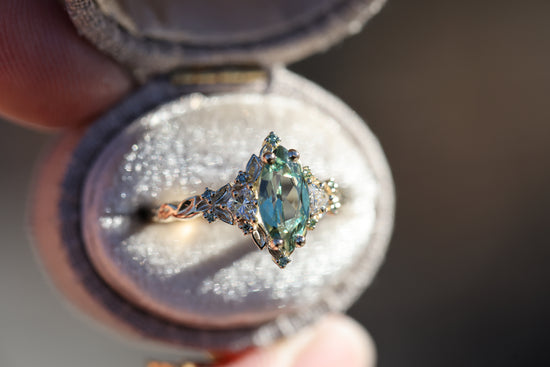 Briar Rose Three Stone with 10x5mm marquise lab green sapphire, mint diamond accents