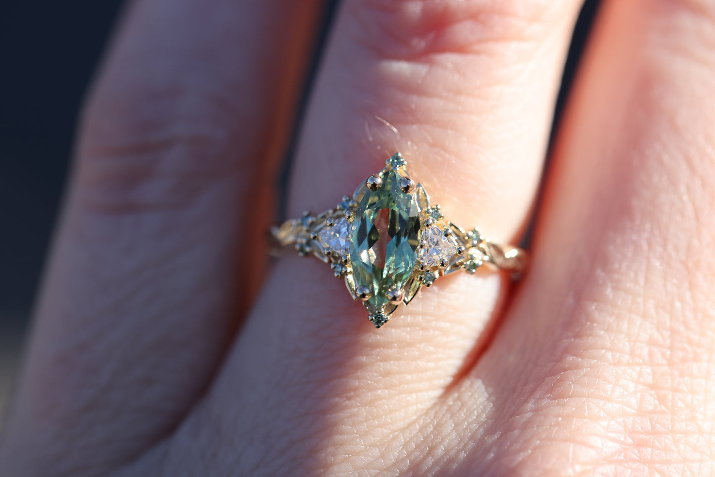 Briar Rose Three Stone with 10x5mm marquise lab green sapphire, mint diamond accents