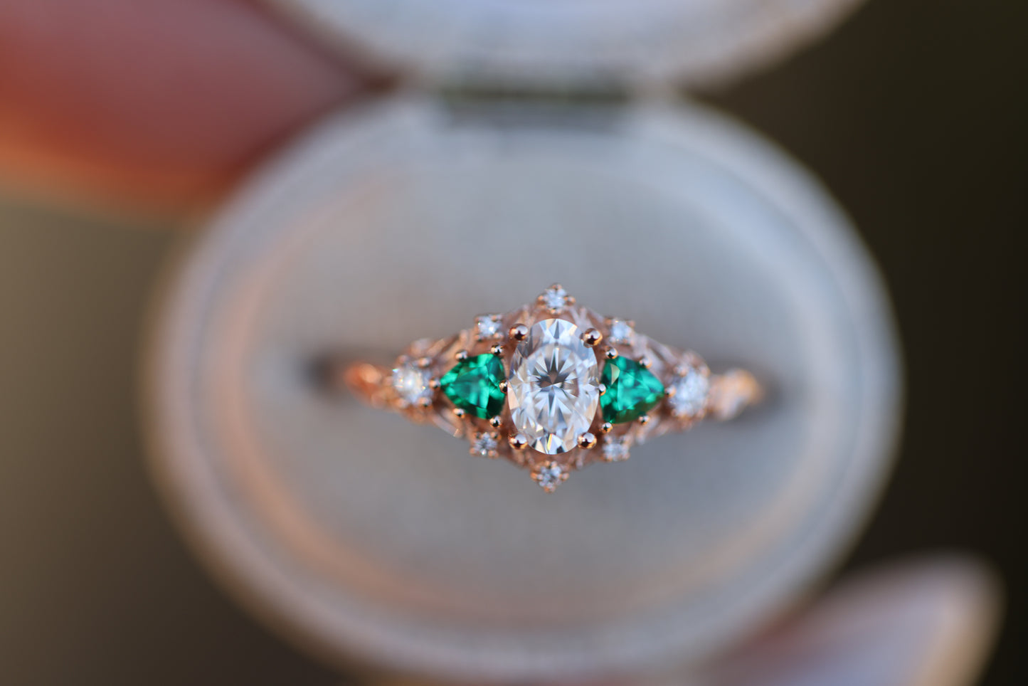Briar rose five stone with moissanite center and lab emerald