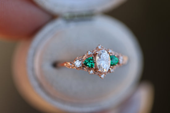 Briar rose five stone with moissanite center and lab emerald