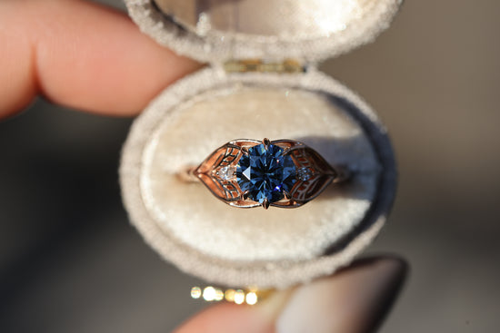 Elvindell three stone with 7mm dark blue moissanite